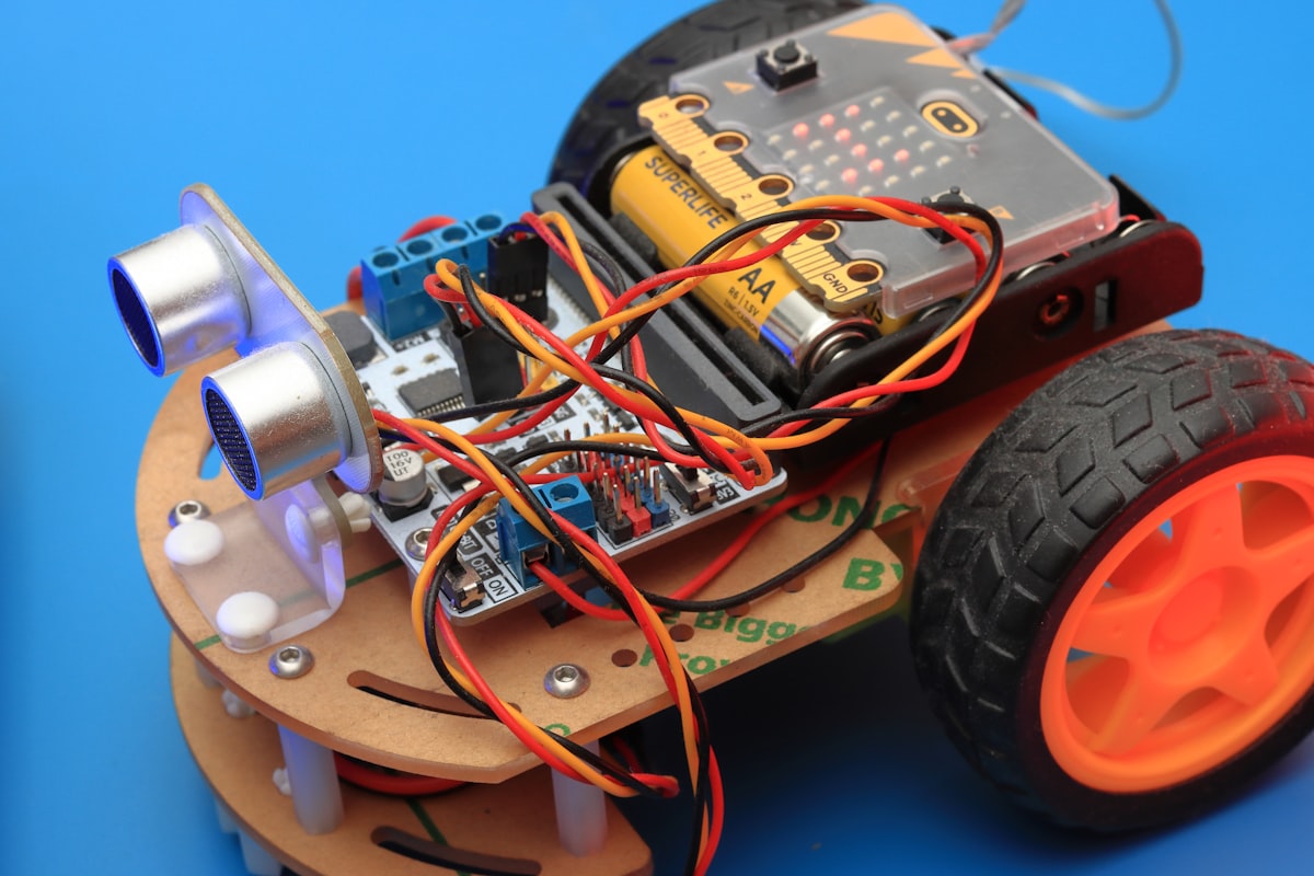 A robot car built from a chassis, ultrasonic sensors, wires and wheels