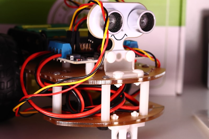 A finished robot with ultrasonic sensors, wires and a circuit board